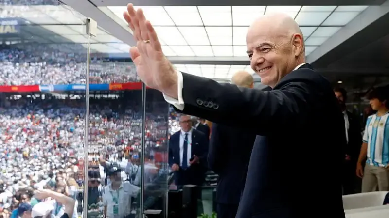 FIFA president Gianni Infantino waves before the World Cup final between Spain and Argentina